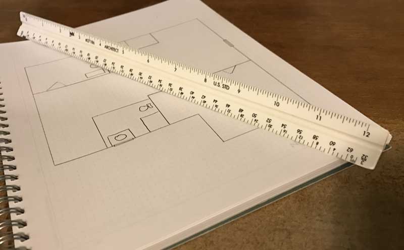 architects rule shown next to architectural blueprint drawing