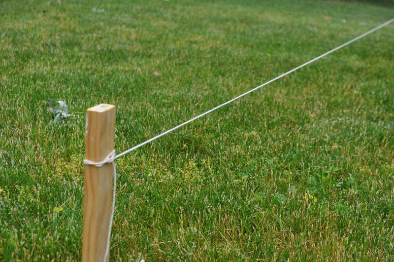 String attached to fence layout stake to  locate the fence line