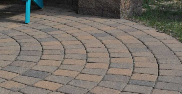 Circular patio with tan paver stones