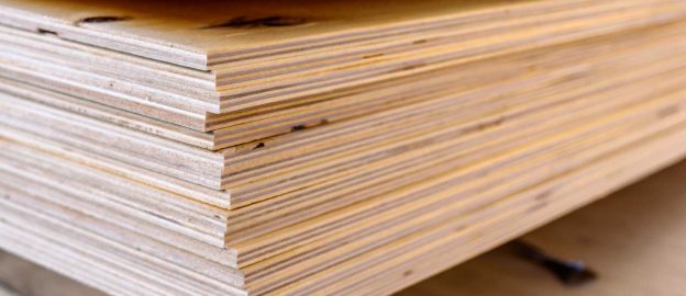 A stack of plywood sheets at a lumber yard