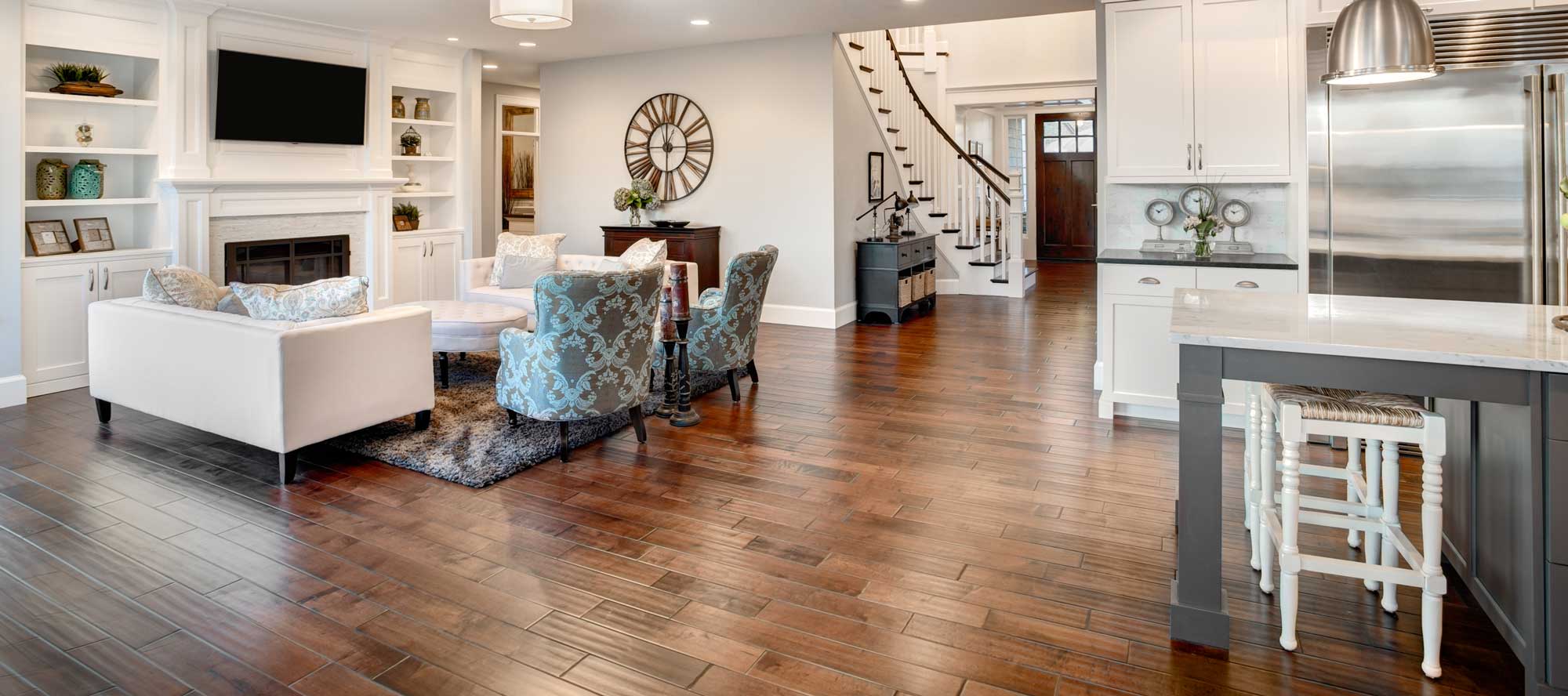 Hardwood floor flowing through kitchen into a family room