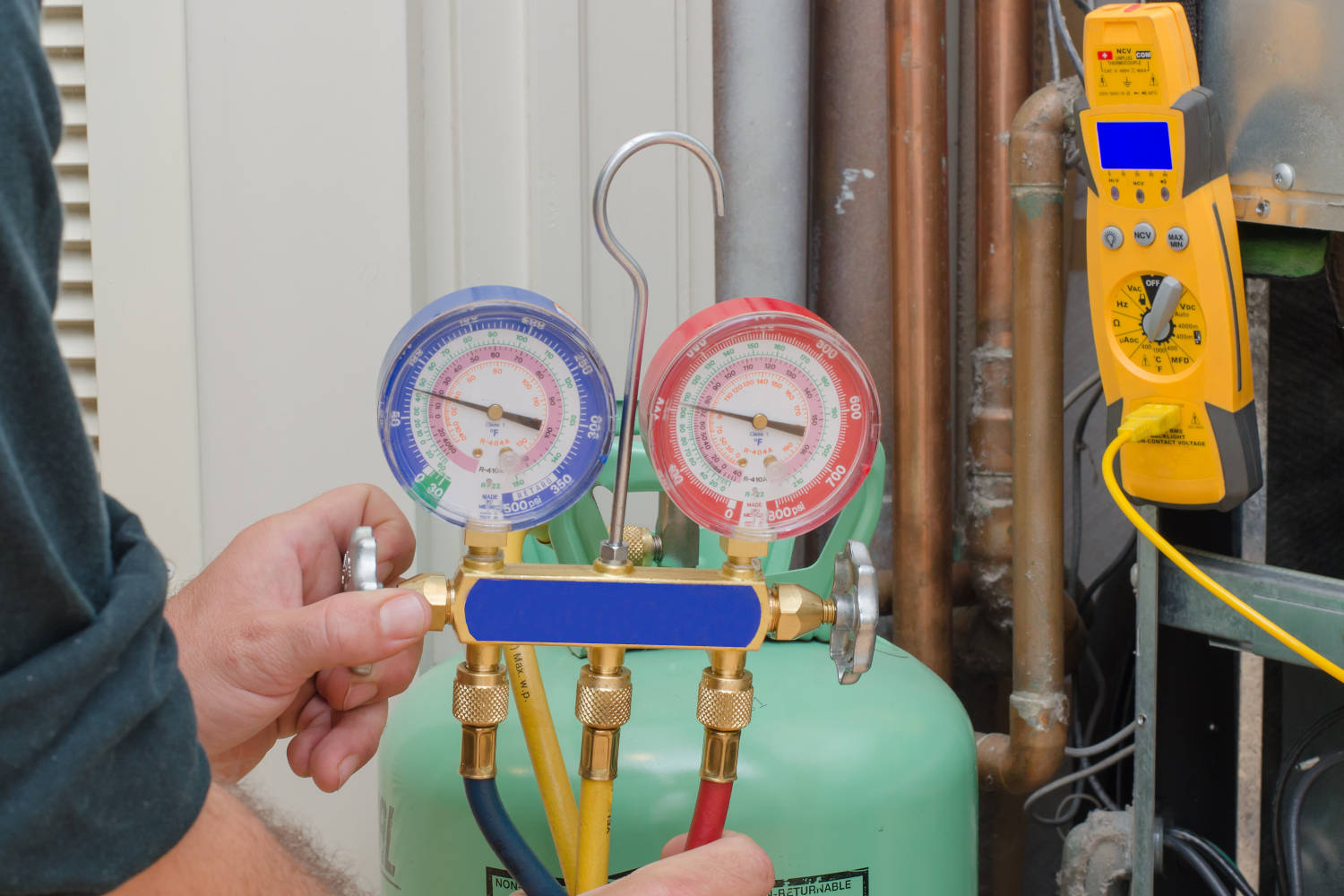 Refrigerant tank and gauges for charging a residential heat pump